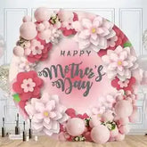 Pink floral mother’s day backdrop with balloons and flowers, likely made of fabric or paper.